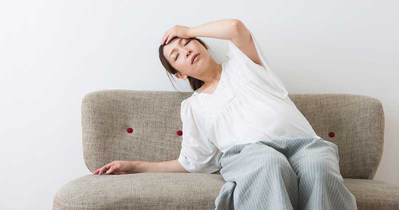 めまいで悩む女性